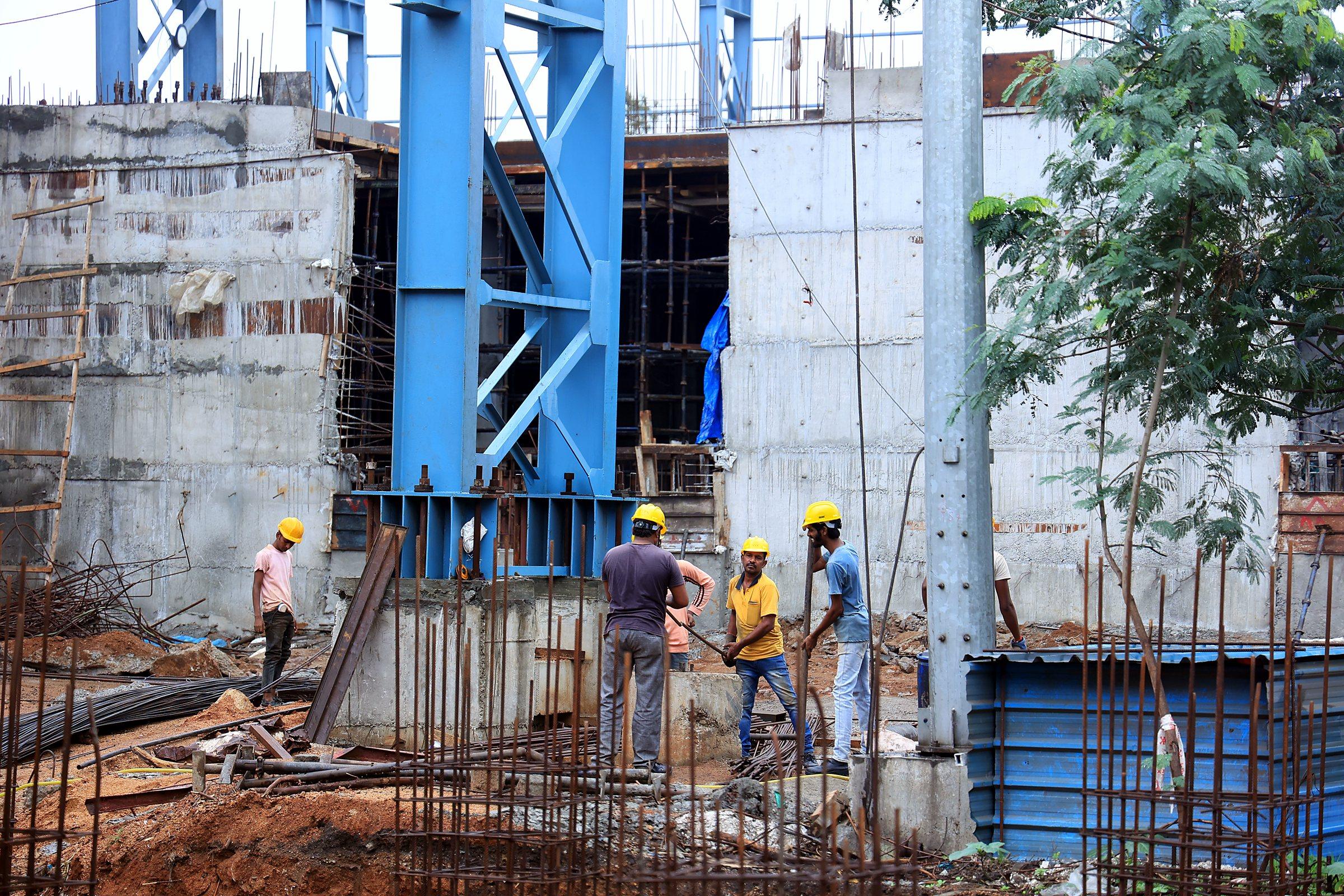 Civil site engineers and construction technicians inspecting pour