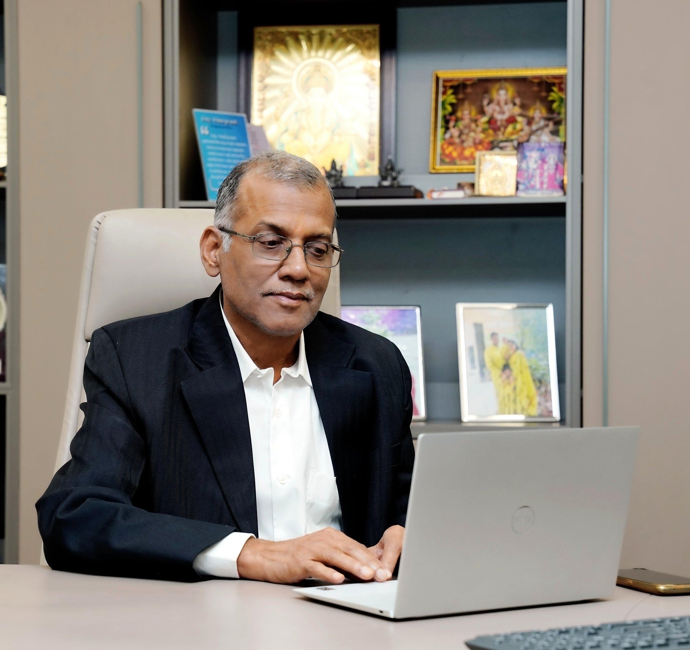 Pramod Agarwal at his desk