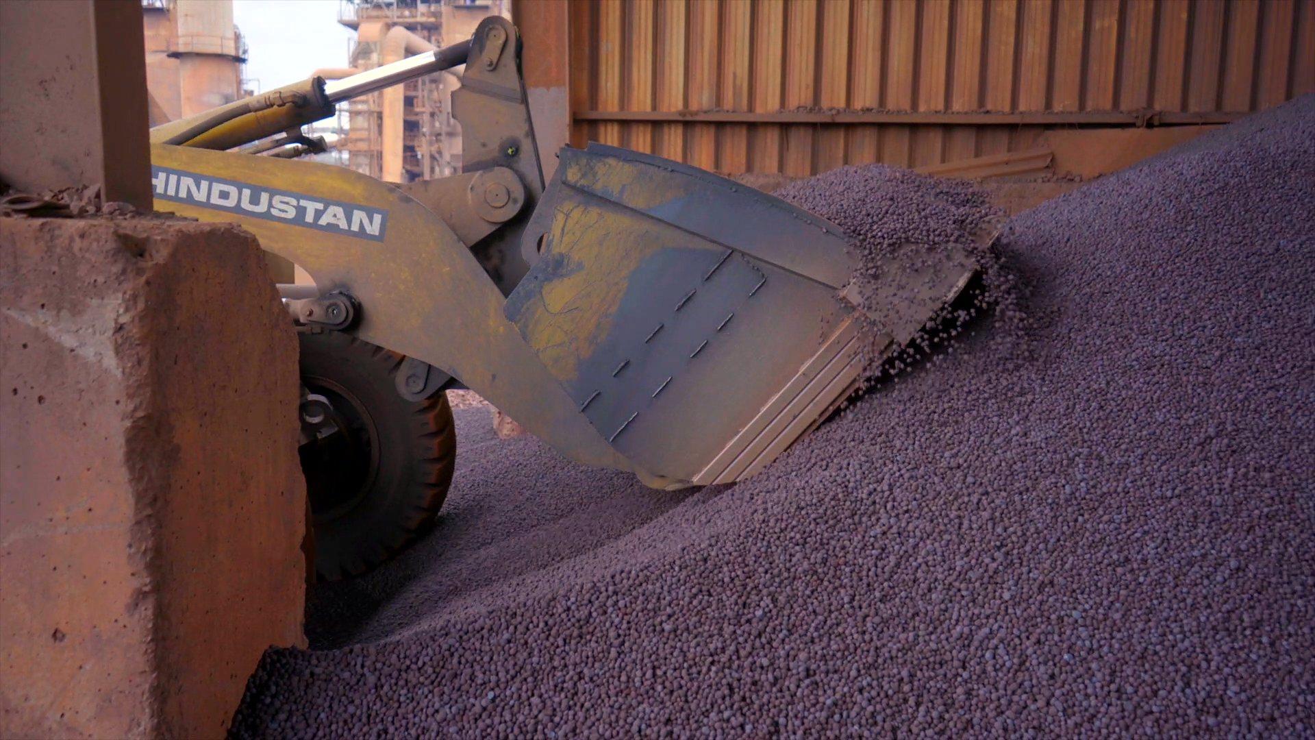 Payloader feeding iron ore to the rotary kiln
